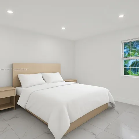 a bedroom with a bed and a lamp