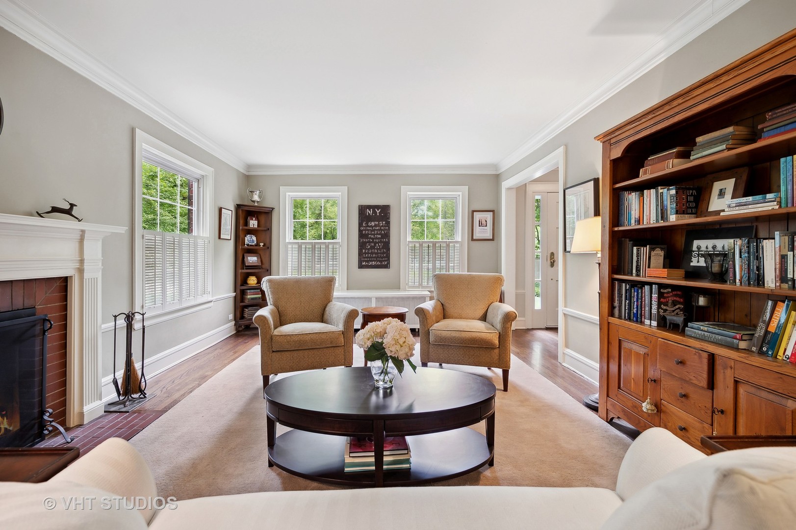 1427 Tower Road Winnetka, IL 60093 - Photo 8 of 45 a living room with furniture and a fireplace