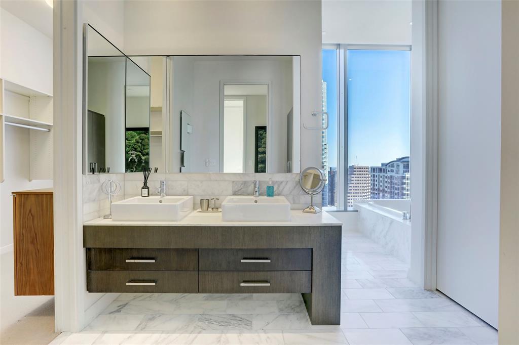210 Lavaca Street, Unit 3401 Austin, TX 78701 - Photo 11 of 19 a bathroom with a sink and a mirror