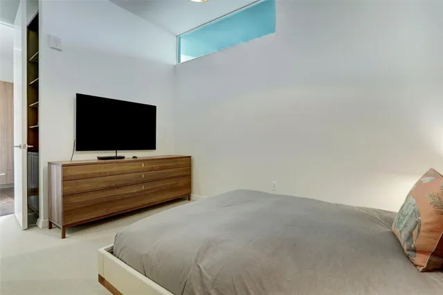 a bathroom with a sink and mirror with bathtub