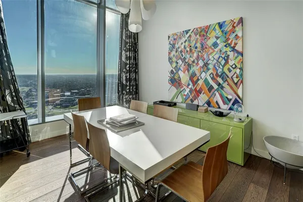 a view of a dining room with furniture and wooden floor