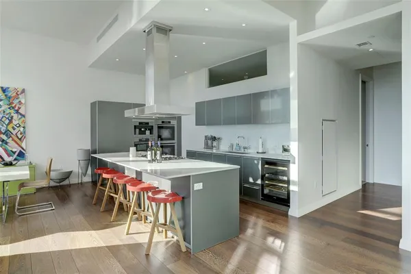 a kitchen with a stove and a refrigerator