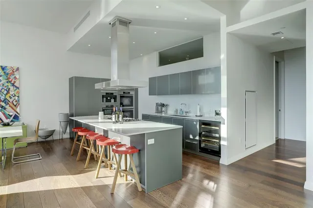 a kitchen with a stove and a refrigerator