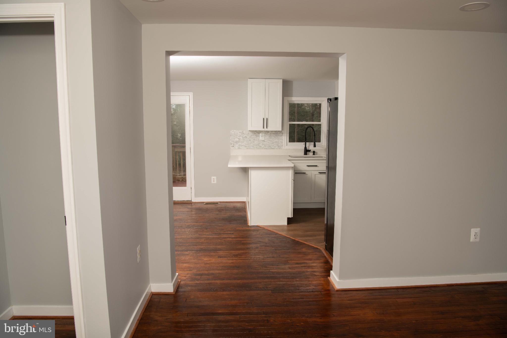 4785 Mountain Road Pasadena, MD 21122 - Photo 16 of 30 Modern open layout with warm wood floors.