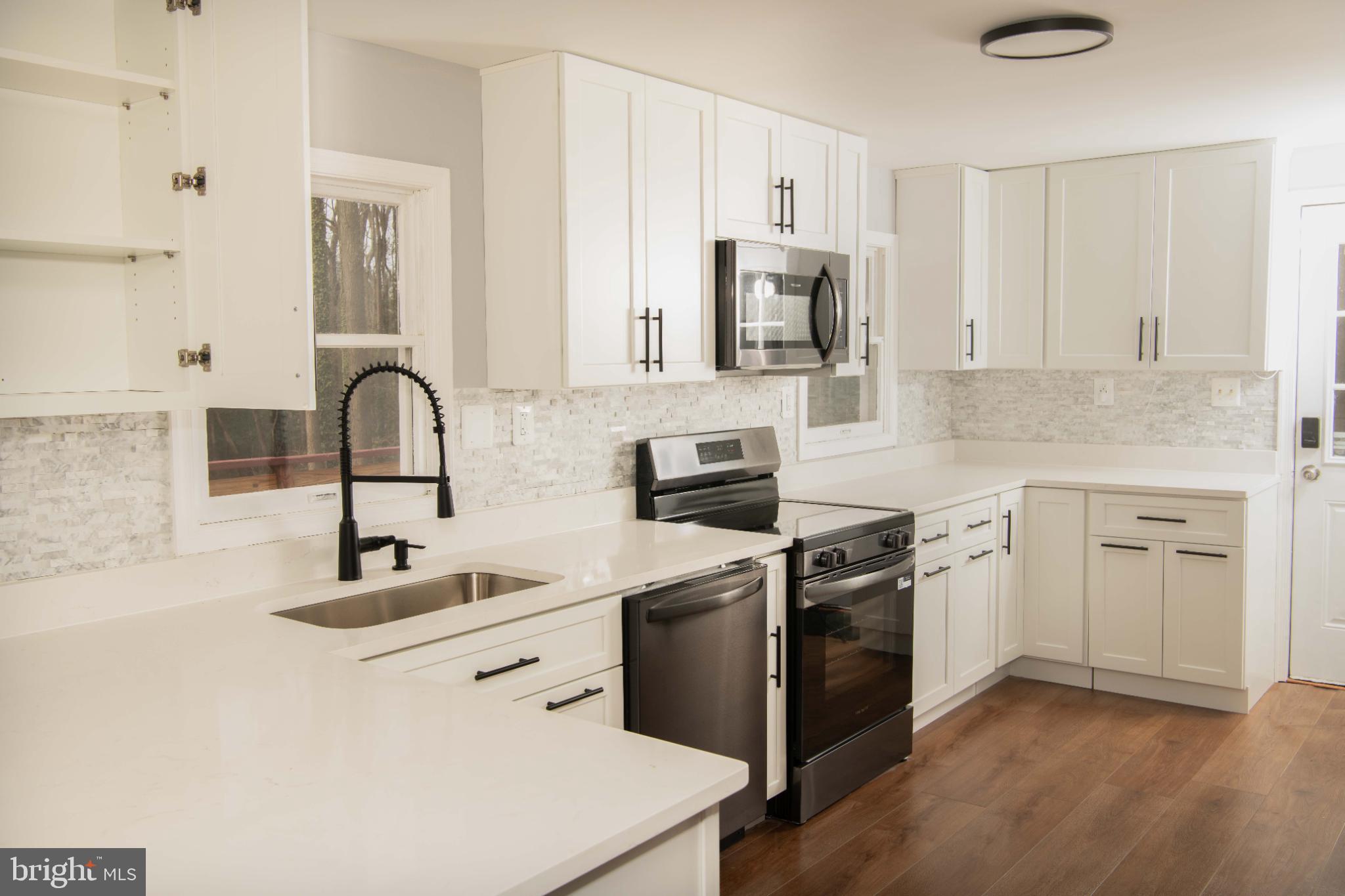 4785 Mountain Road Pasadena, MD 21122 - Photo 2 of 30 Modern kitchen with sleek finishes.