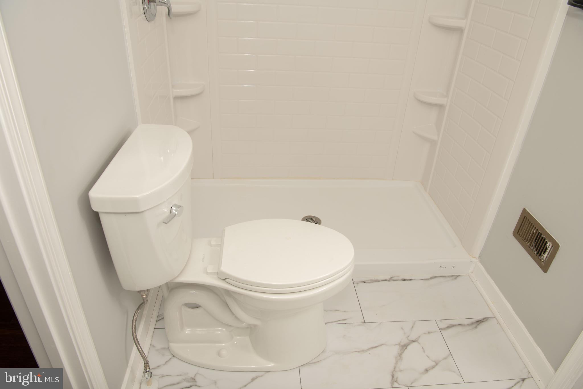 4785 Mountain Road Pasadena, MD 21122 - Photo 22 of 30 Modern bathroom with sleek fixtures.