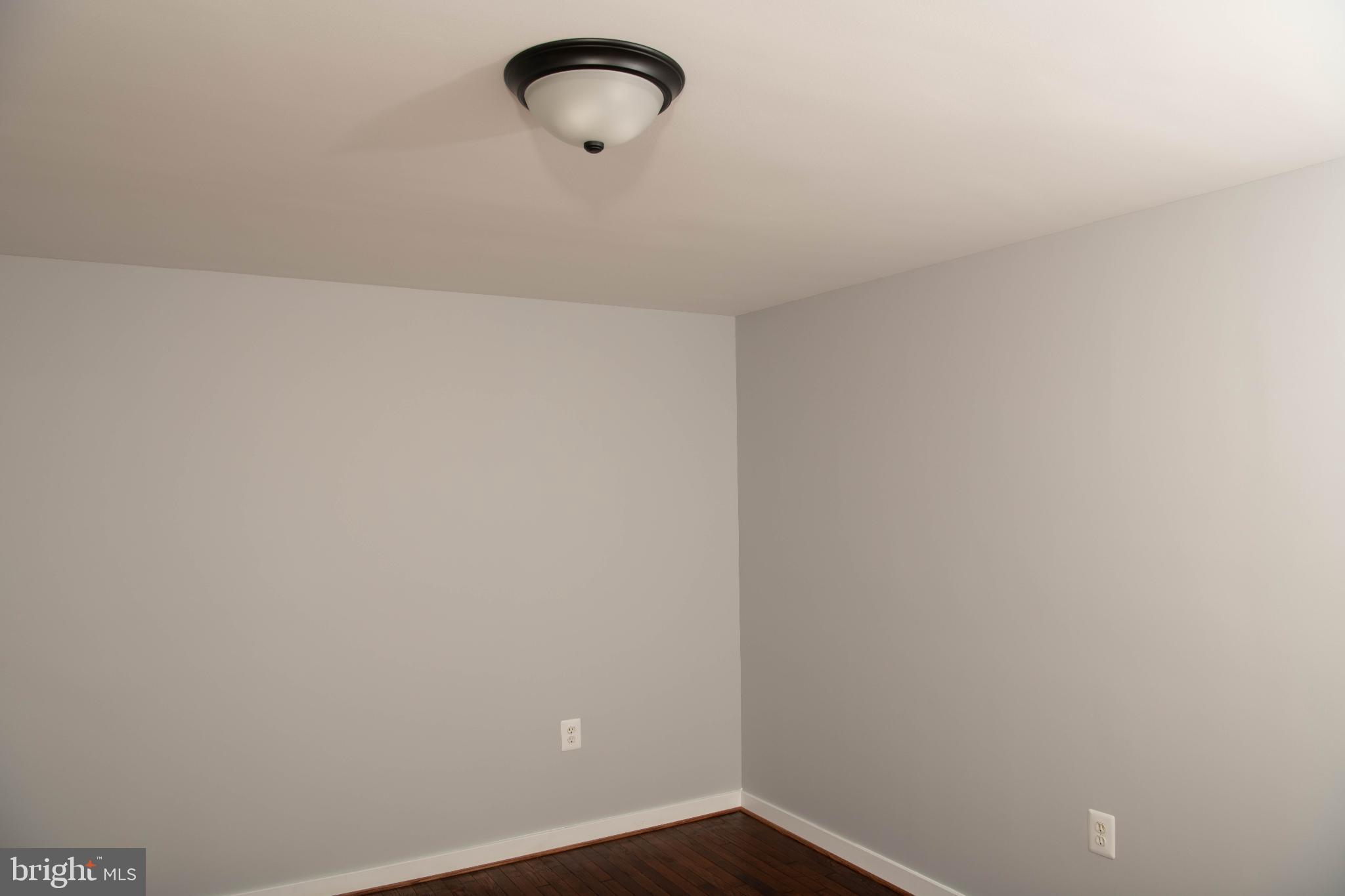 4785 Mountain Road Pasadena, MD 21122 - Photo 27 of 30 Spacious room with soft gray walls.