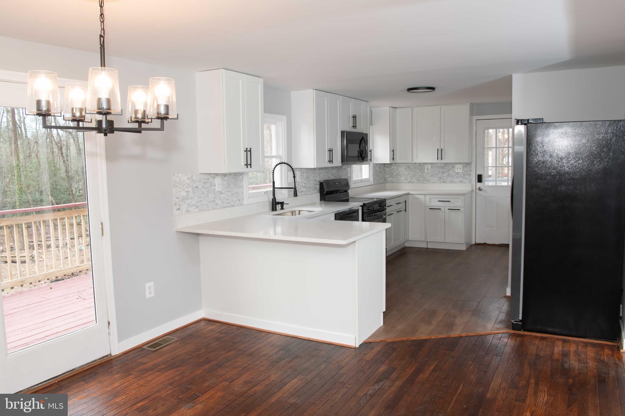 4785 Mountain Road Pasadena, MD 21122 - Photo 6 of 30 Modern kitchen with sleek finishes.