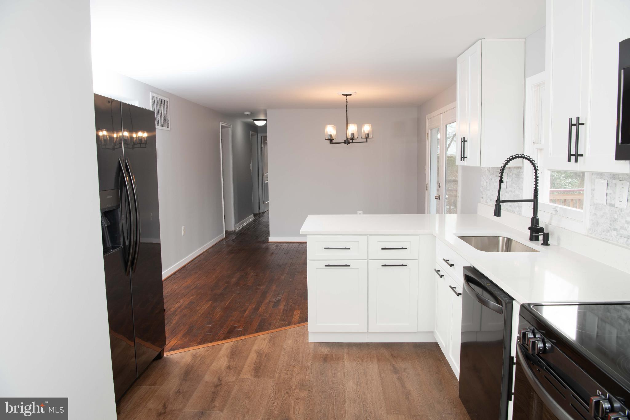 4785 Mountain Road Pasadena, MD 21122 - Photo 7 of 30 Modern kitchen with sleek finishes.