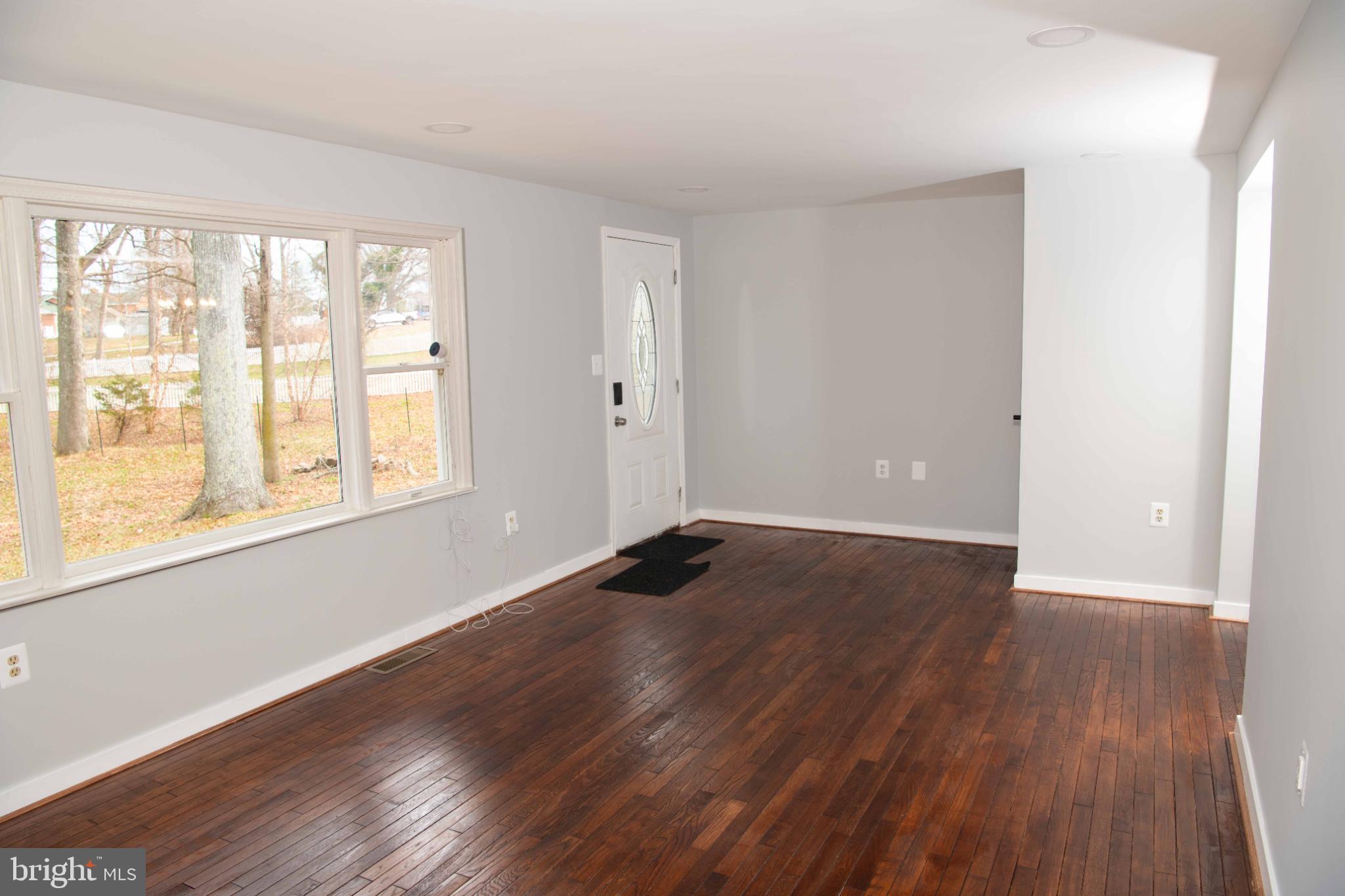 4785 Mountain Road Pasadena, MD 21122 - Photo 10 of 30 Bright and airy entryway with hardwood floors.