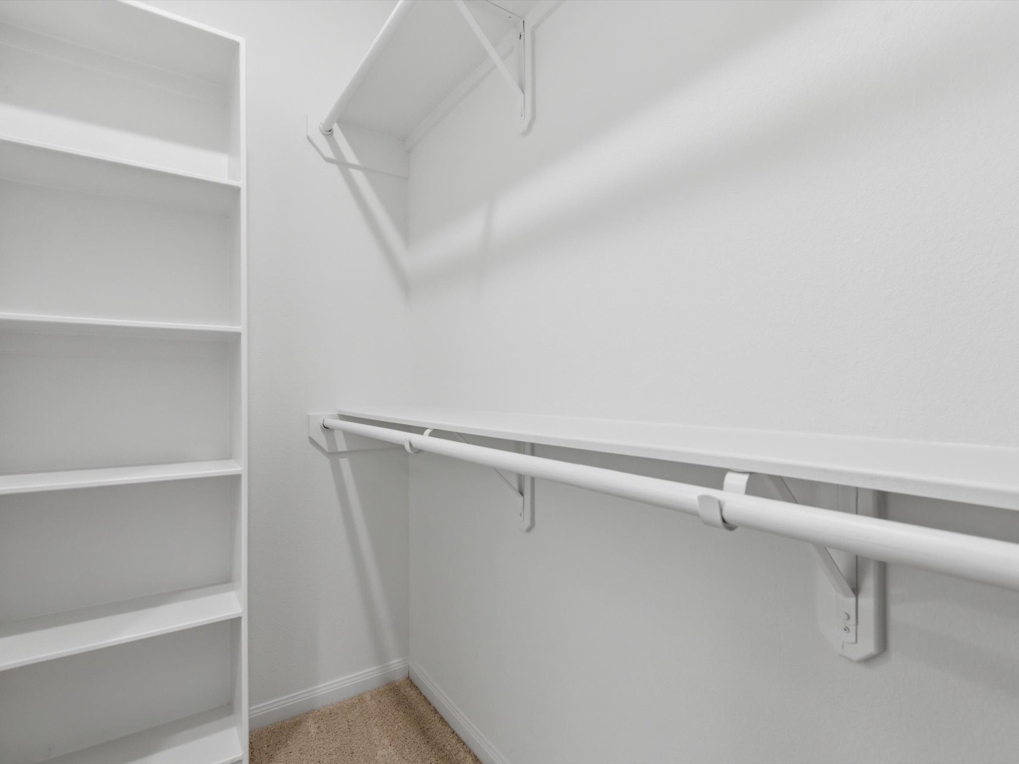 2803 Topiary Lane Houston, TX 77014 - Photo 21 of 31 The expansive primary walk-in closet offers generous built-in storage and exceptional organization.