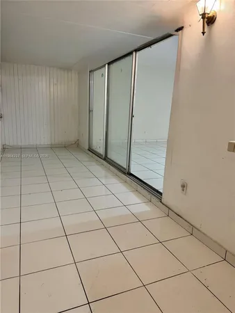 a kitchen with cabinets and appliances