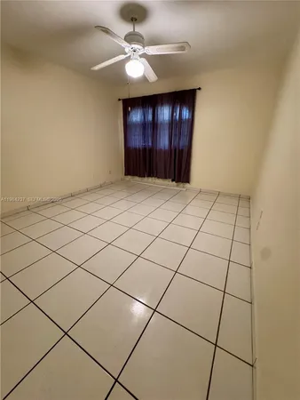 a bathroom with a shower and a mirror