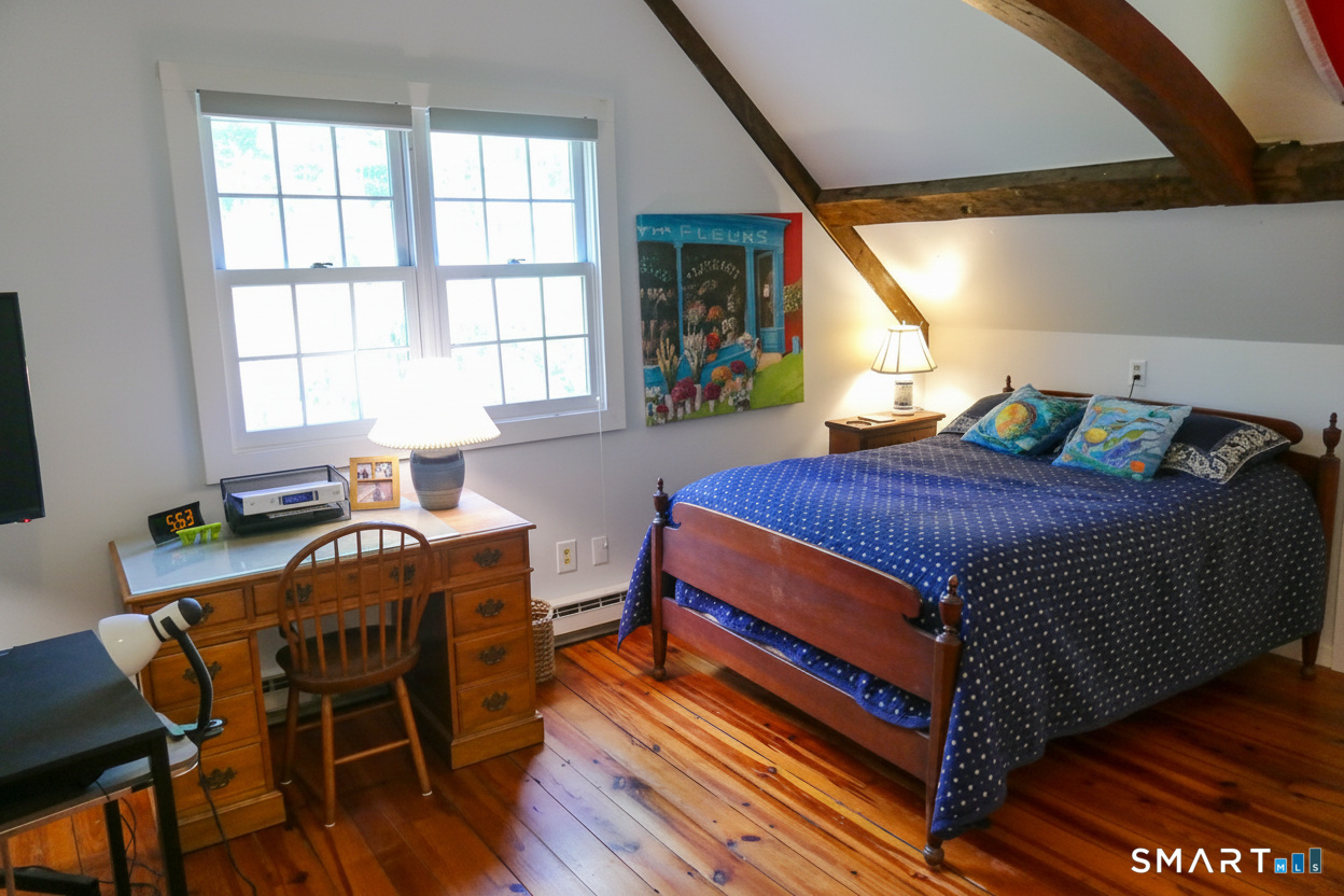 147 Boston Street Guilford, CT 06437 - Photo 26 of 38 a bedroom with a bed and a window