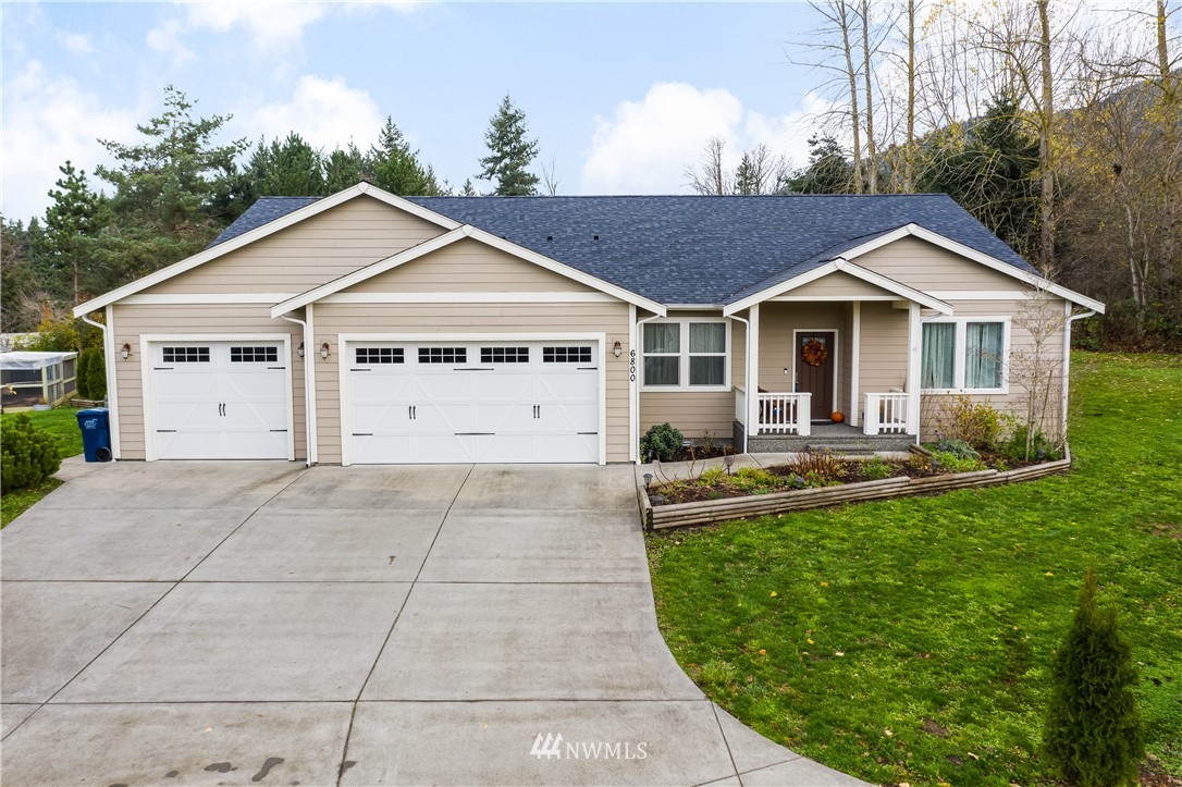 6800 Goodwin Road Everson, WA 98247 - Photo 1 of 40 a view of a house with backyard and garden