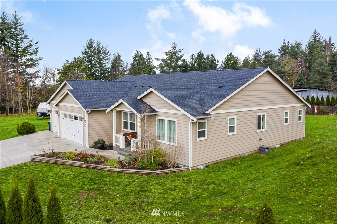 6800 Goodwin Road Everson, WA 98247 - Photo 2 of 40 a view of a house with a yard potted plants and large tree