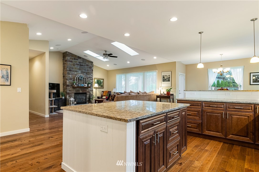 6800 Goodwin Road Everson, WA 98247 - Photo 12 of 40 a kitchen with stainless steel appliances granite countertop a sink and stove