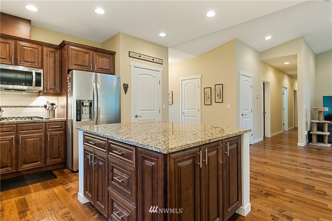 6800 Goodwin Road Everson, WA 98247 - Photo 13 of 40 a kitchen with stainless steel appliances granite countertop a refrigerator and a stove top oven