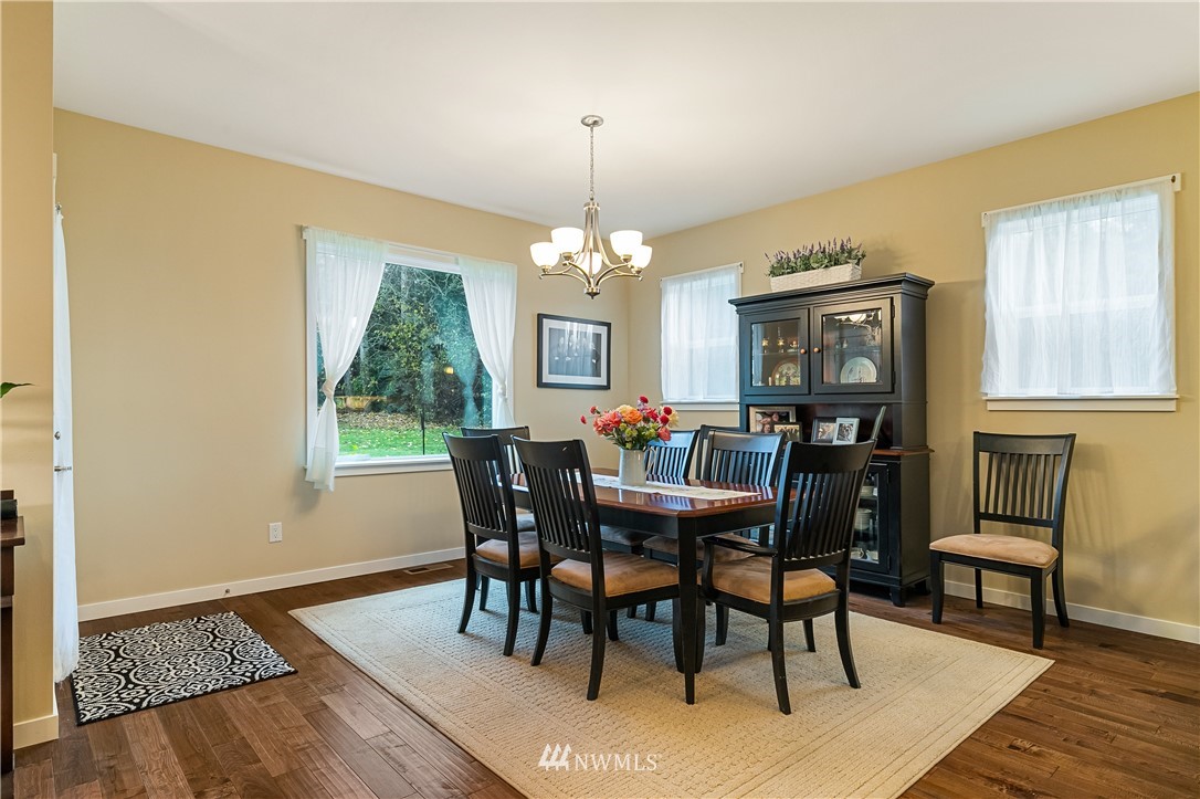 6800 Goodwin Road Everson, WA 98247 - Photo 18 of 40 a view of a dining room with furniture window and wooden floor