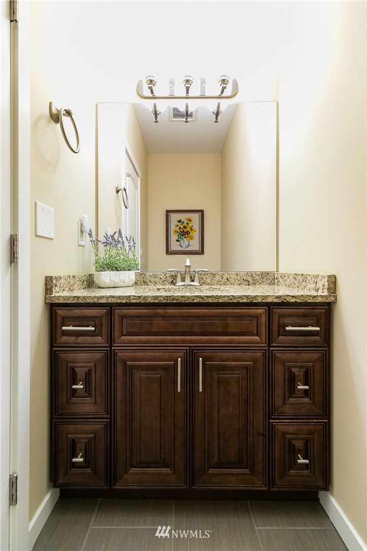 6800 Goodwin Road Everson, WA 98247 - Photo 24 of 40 a bathroom with a granite countertop sink and a mirror