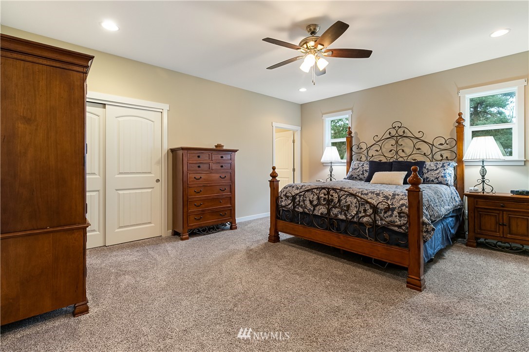 6800 Goodwin Road Everson, WA 98247 - Photo 31 of 40 a bedroom with a bed and a ceiling fan