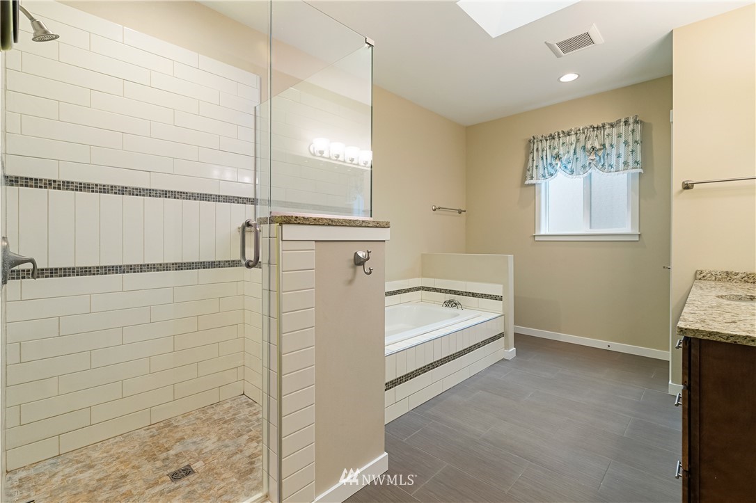 6800 Goodwin Road Everson, WA 98247 - Photo 34 of 40 a bathroom with a tub and shower