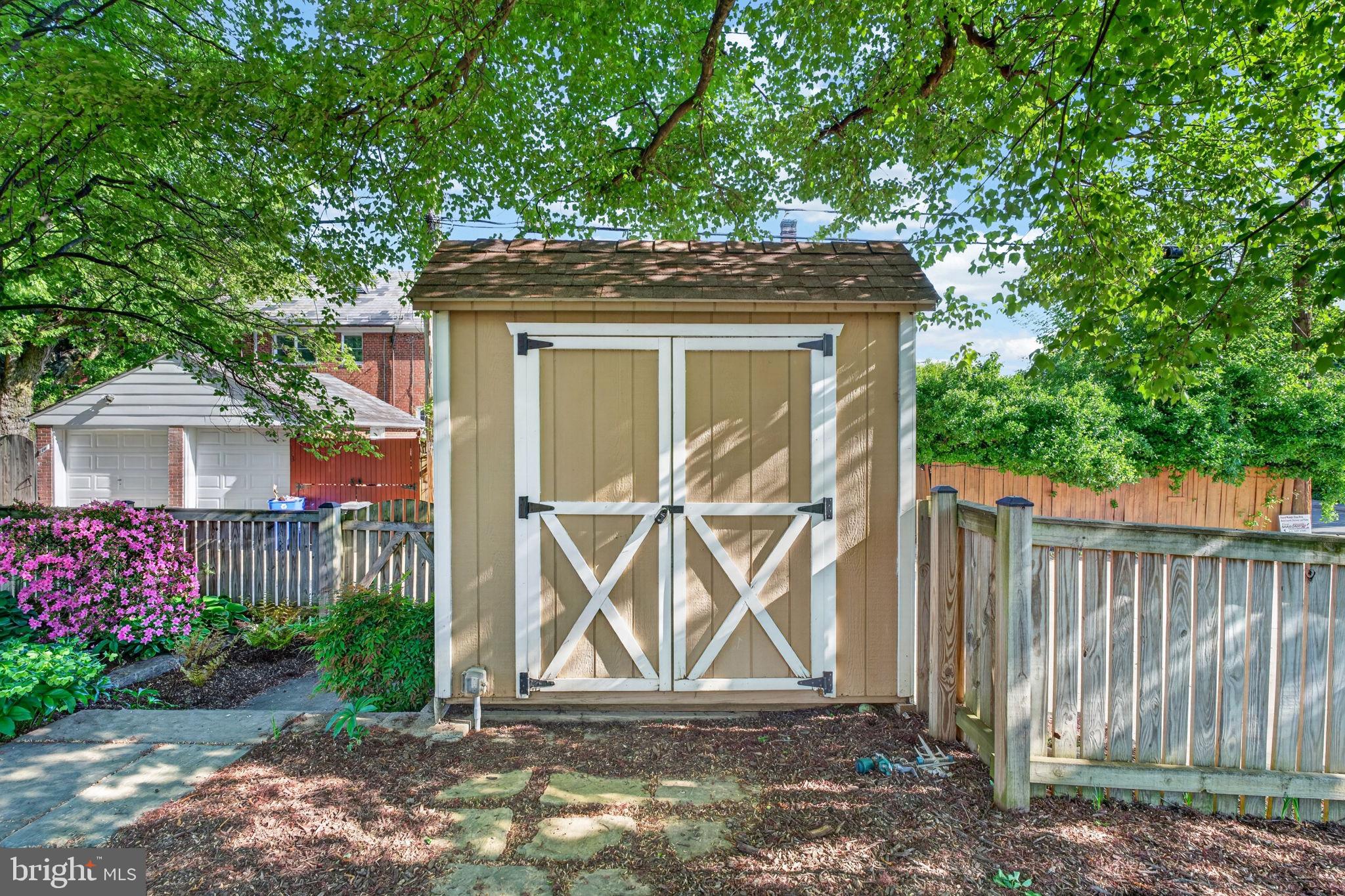 158 Hopkins Road Baltimore, MD 21212 - Photo 56 of 68 Charming garden shed nestled in greenery.