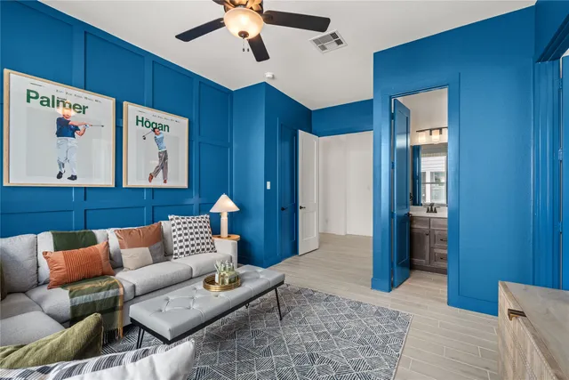 a view of walk in closet with clothes