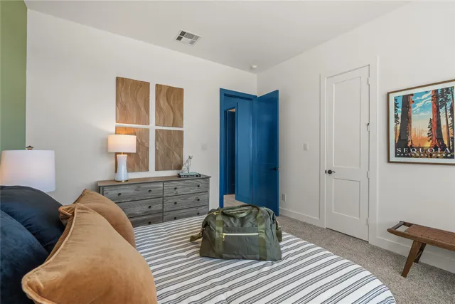 a kitchen with stainless steel appliances granite countertop a kitchen island a stove and a refrigerator