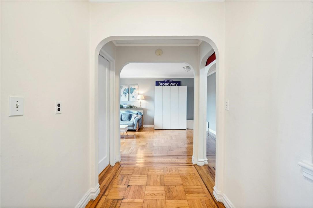 2025 Valentine Avenue, Unit 6B Bronx, NY 10457 - Photo 10 of 15 Hallway with light parquet flooring