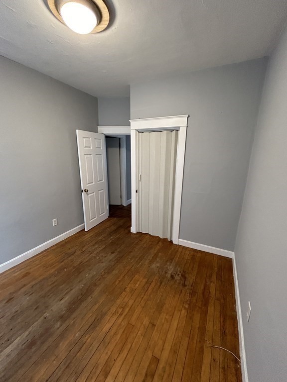 623-631 Birch Street, Unit 1 Fall River, MA 02724 - Photo 15 of 17 a view of an empty room and wooden floor