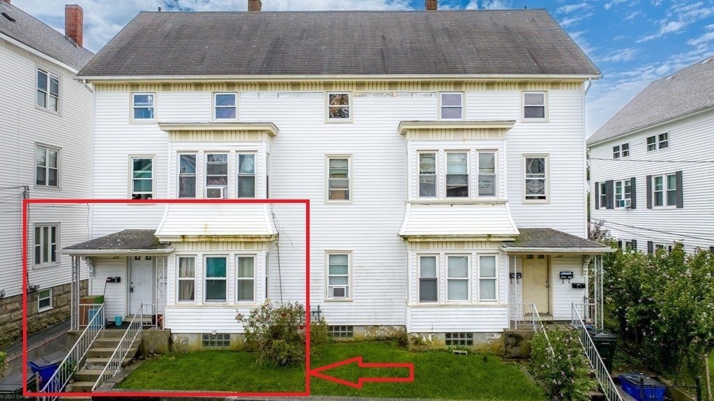 623-631 Birch Street, Unit 1 Fall River, MA 02724 - Photo 17 of 17 a front view of a residential apartment building with a yard