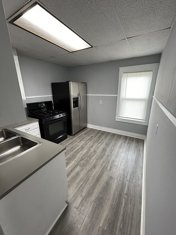 623-631 Birch Street, Unit 1 Fall River, MA 02724 - Photo 5 of 17 a view of a livingroom with a flat screen tv