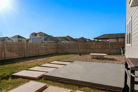 a view of a backyard with sitting area