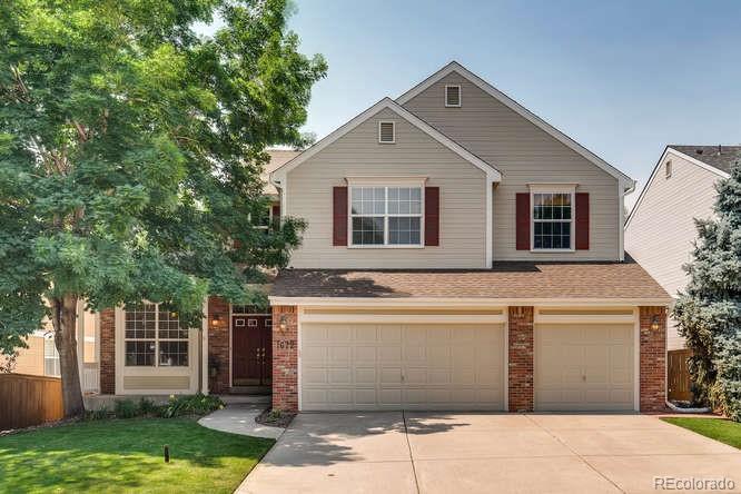 a front view of a house with a garage