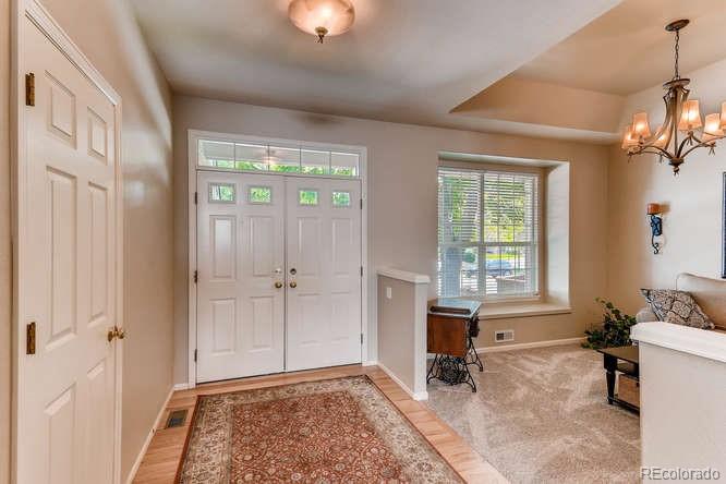 1672 Spring Water Place Highlands Ranch, CO 80129 - Photo 3 of 25 a view of a bedroom with window and furniture