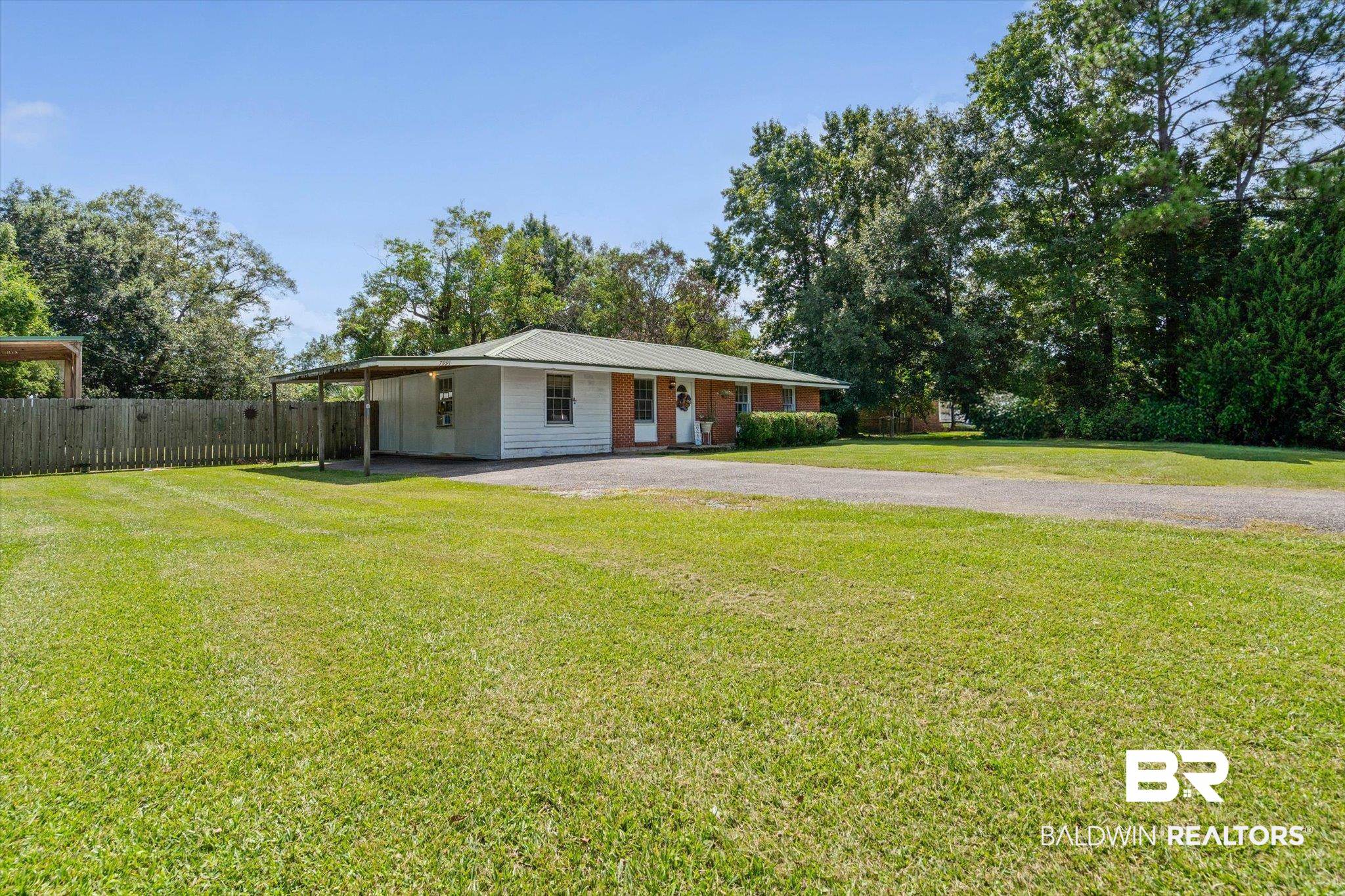 7991 Three Notch Road Theodore, AL 36582 - Photo 19 of 22 View of front of home with an attached carport and driveway