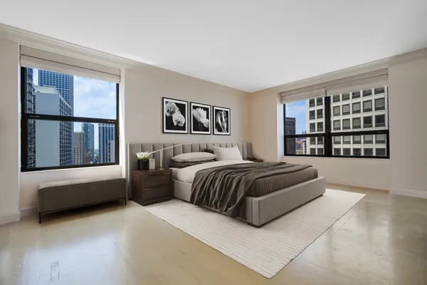 a bedroom with a large bed and a window