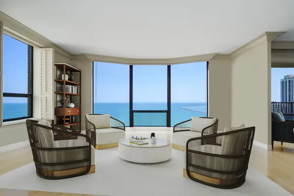 a living room with furniture and large windows