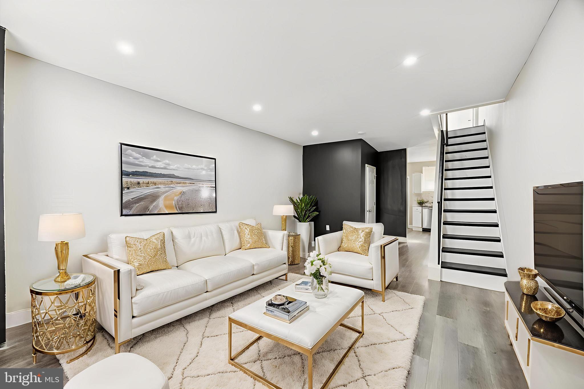 2336 Pierce Street Philadelphia, PA 19145 - Photo 1 of 18 a living room with furniture a large window and a flat screen tv