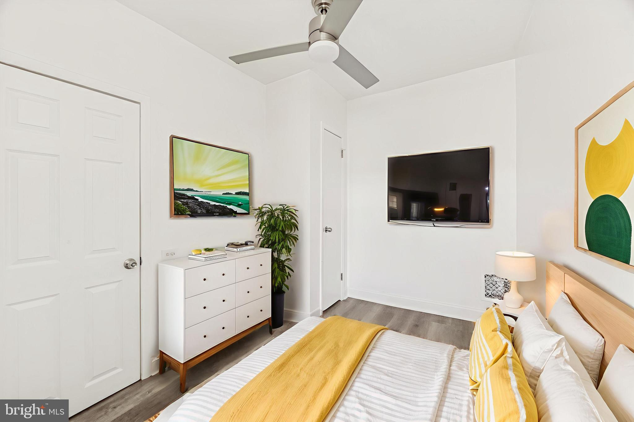 2336 Pierce Street Philadelphia, PA 19145 - Photo 11 of 18 a bedroom with a bed and a flat screen tv