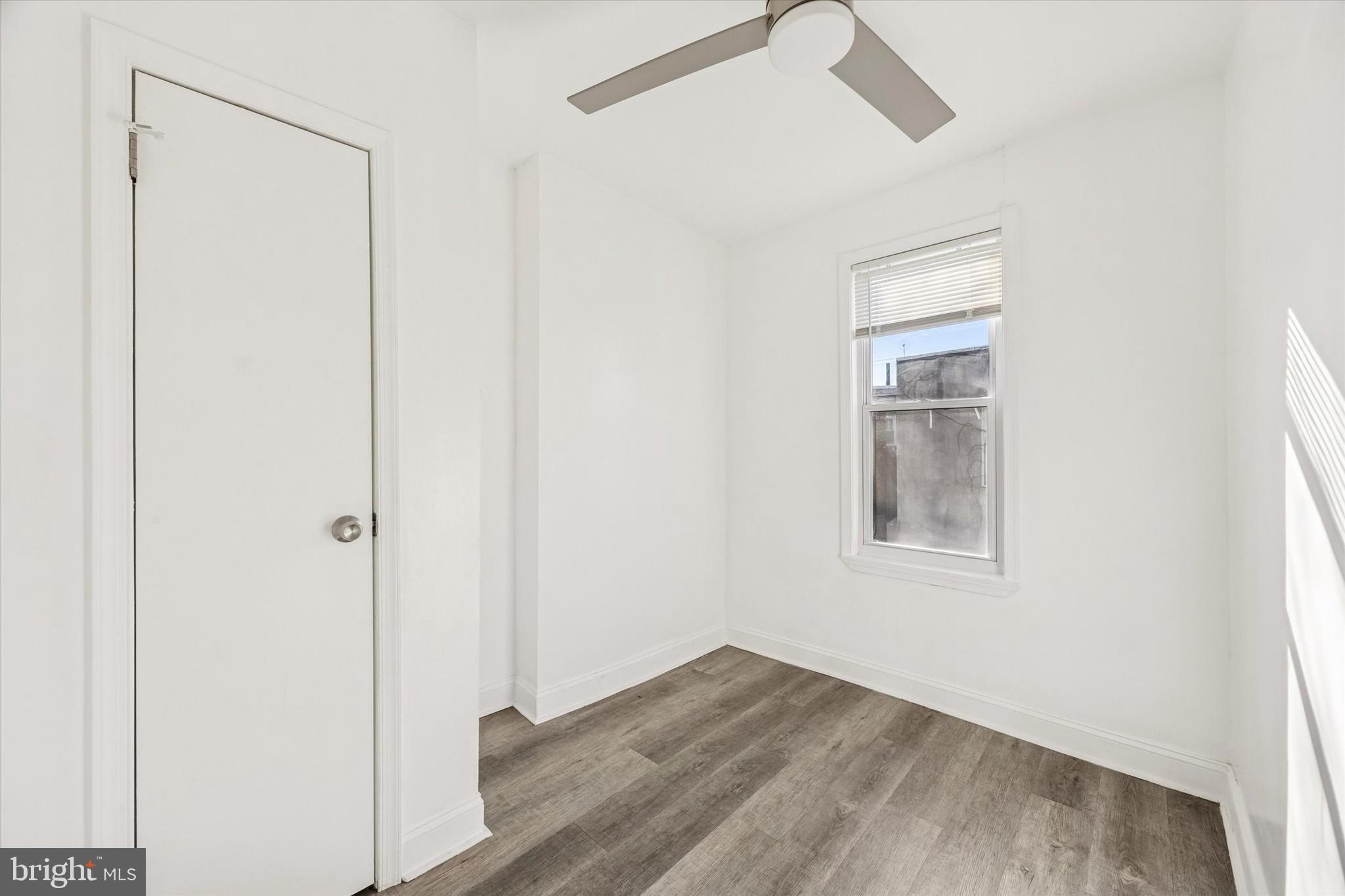 2336 Pierce Street Philadelphia, PA 19145 - Photo 15 of 18 a view of an empty room with wooden floor and a window
