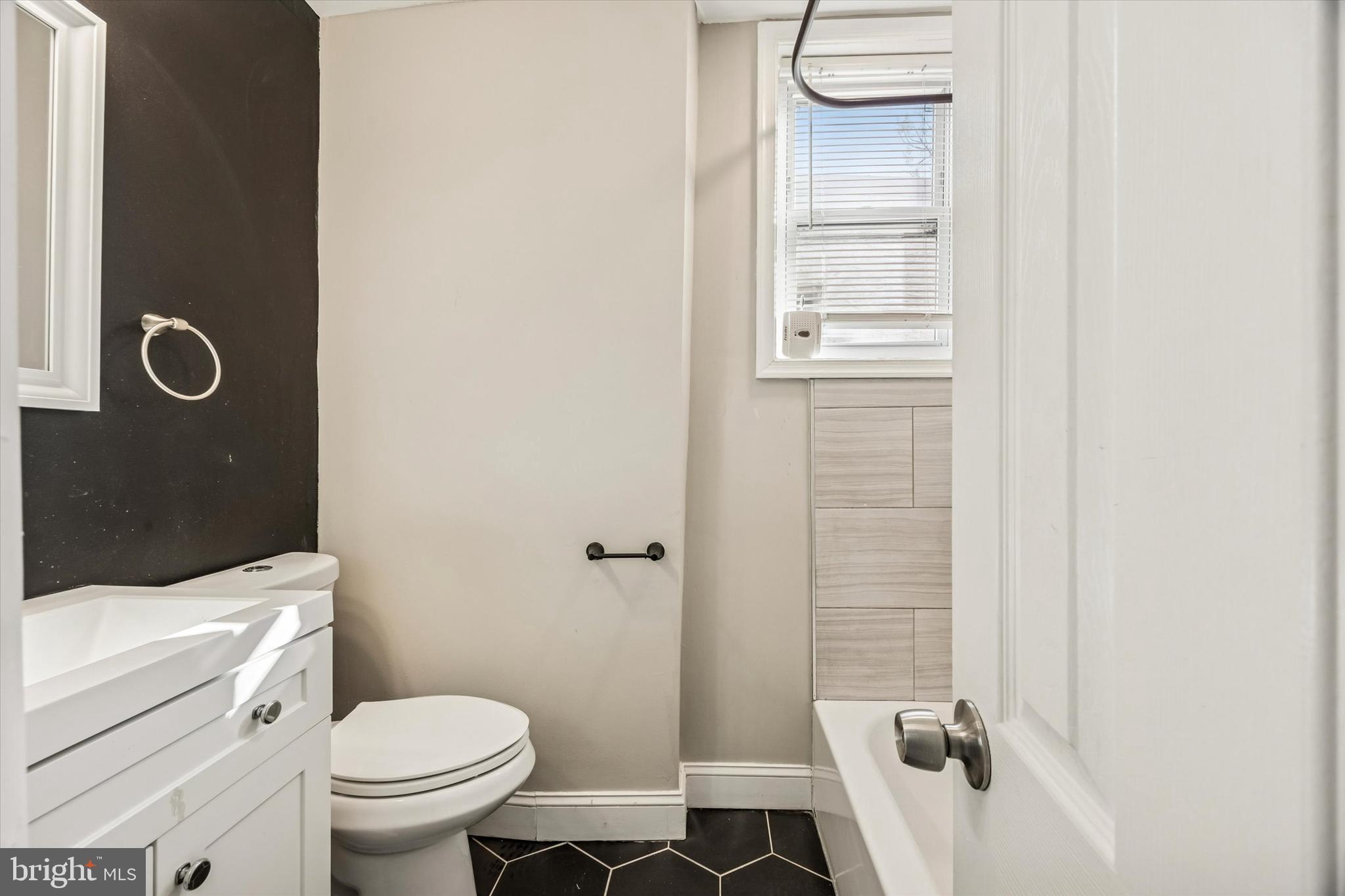 2336 Pierce Street Philadelphia, PA 19145 - Photo 7 of 18 a bathroom with a toilet sink and shower