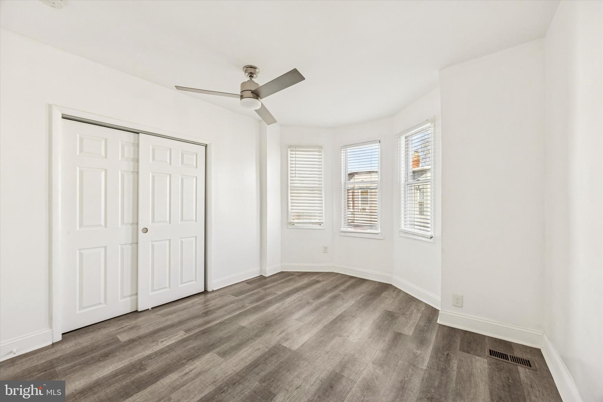 2336 Pierce Street Philadelphia, PA 19145 - Photo 9 of 18 a view of empty room with wooden floor and fan