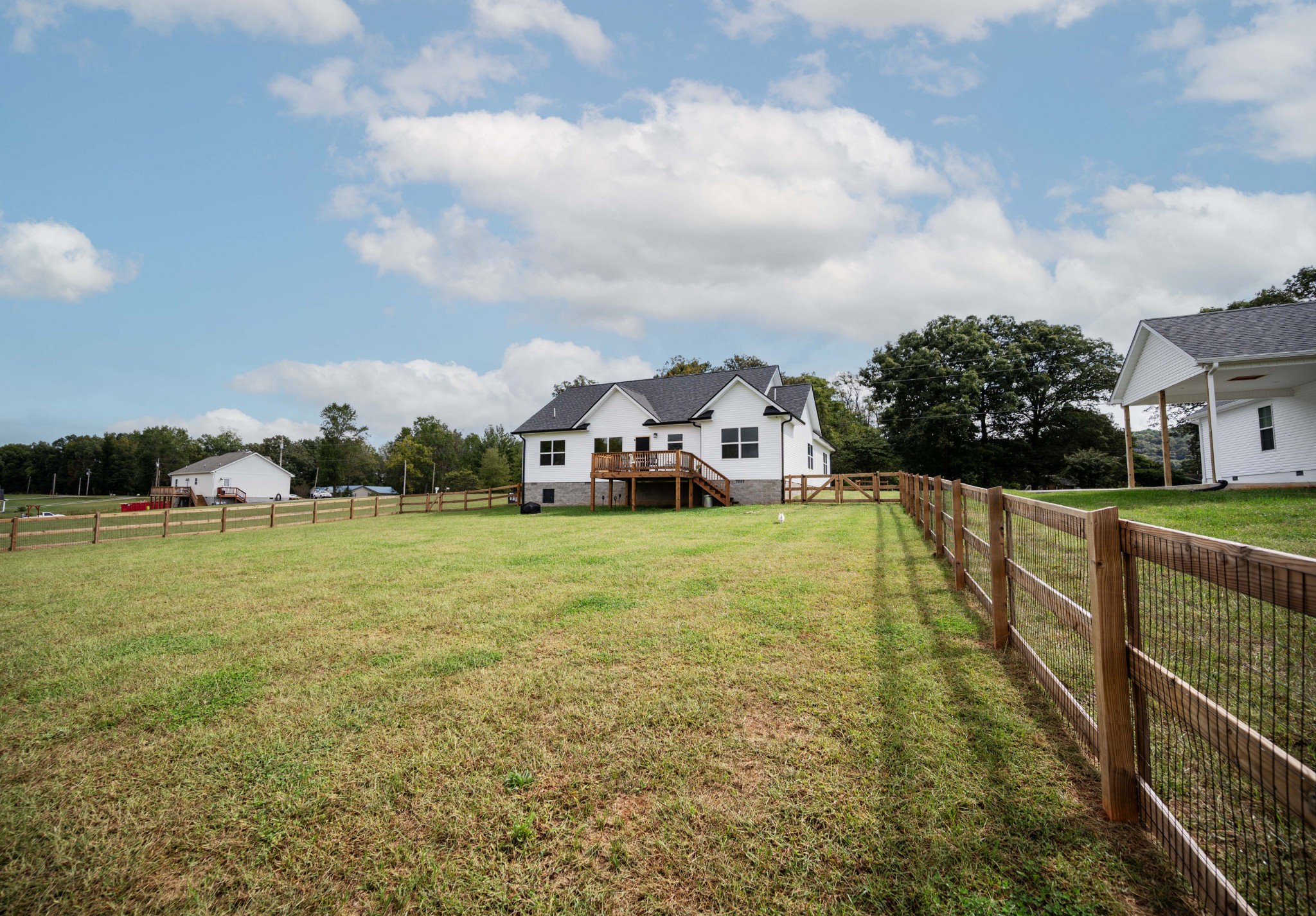 536 Frank Anderson Road Sparta, TN 38583 - Photo 22 of 25 a view of houses with swimming pool outdoor seating and barbeque in the background