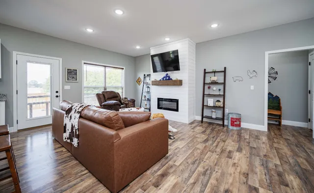 a living room with furniture and a fireplace