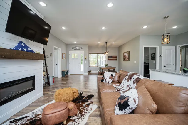 a living room with furniture or flat screen tv and a fireplace