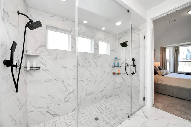 a bathroom with a bathtub and a shower