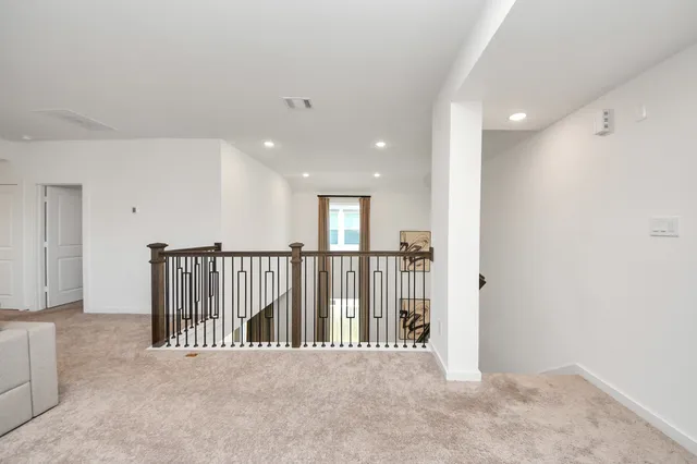 a bedroom with a bed and dresser