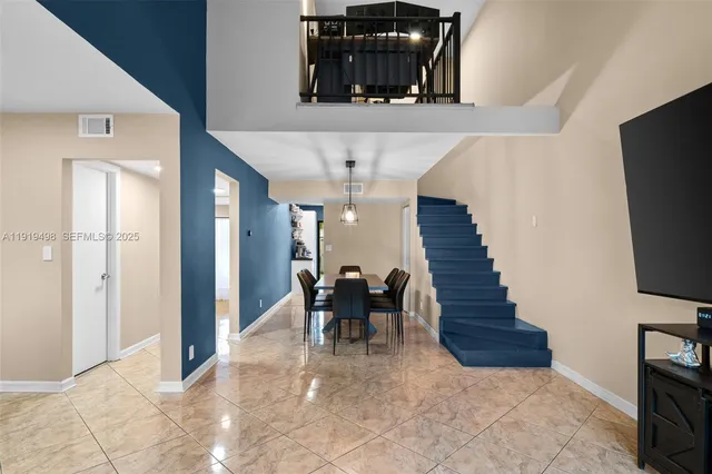 a view of entryway and hall with dining room
